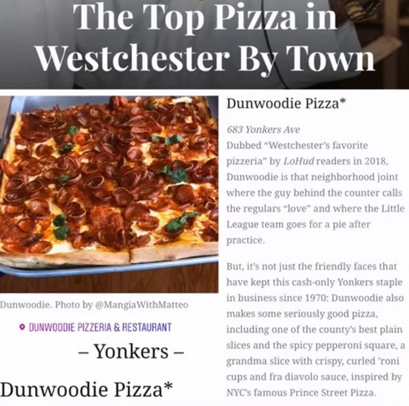 A rectangular Dunwoodie Pizza with abundant pepperoni and fresh basil, cut into squares.